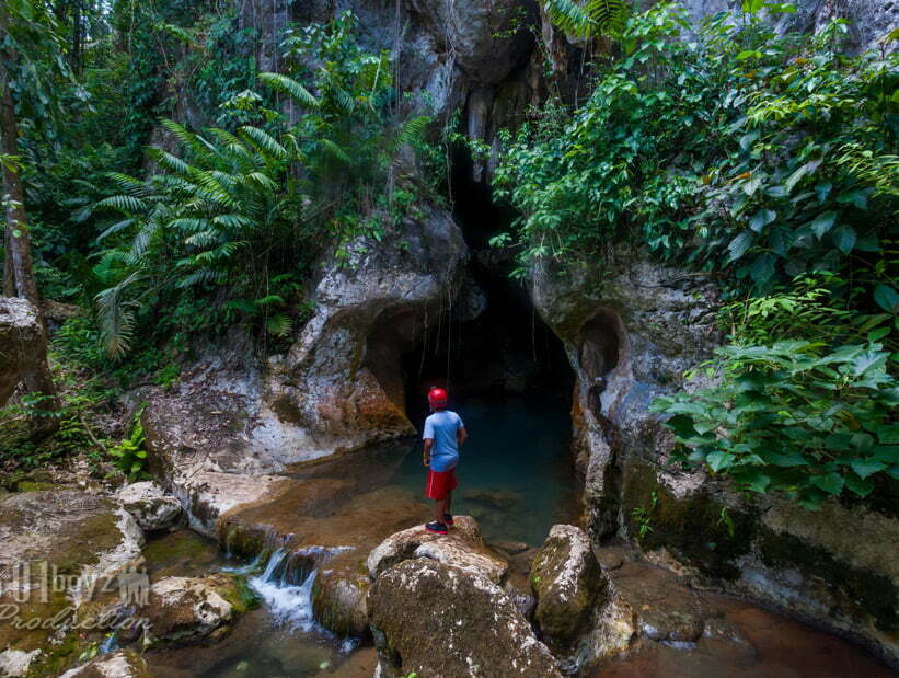 boy at belize atm cave tour entrance